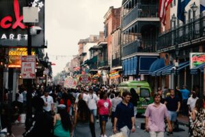 people walking on paved road of New Orleans which is one of the most Awesome cities in America