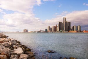 wide angle photography of city near body of water in Detroit which is one of the most miserable cities in America 